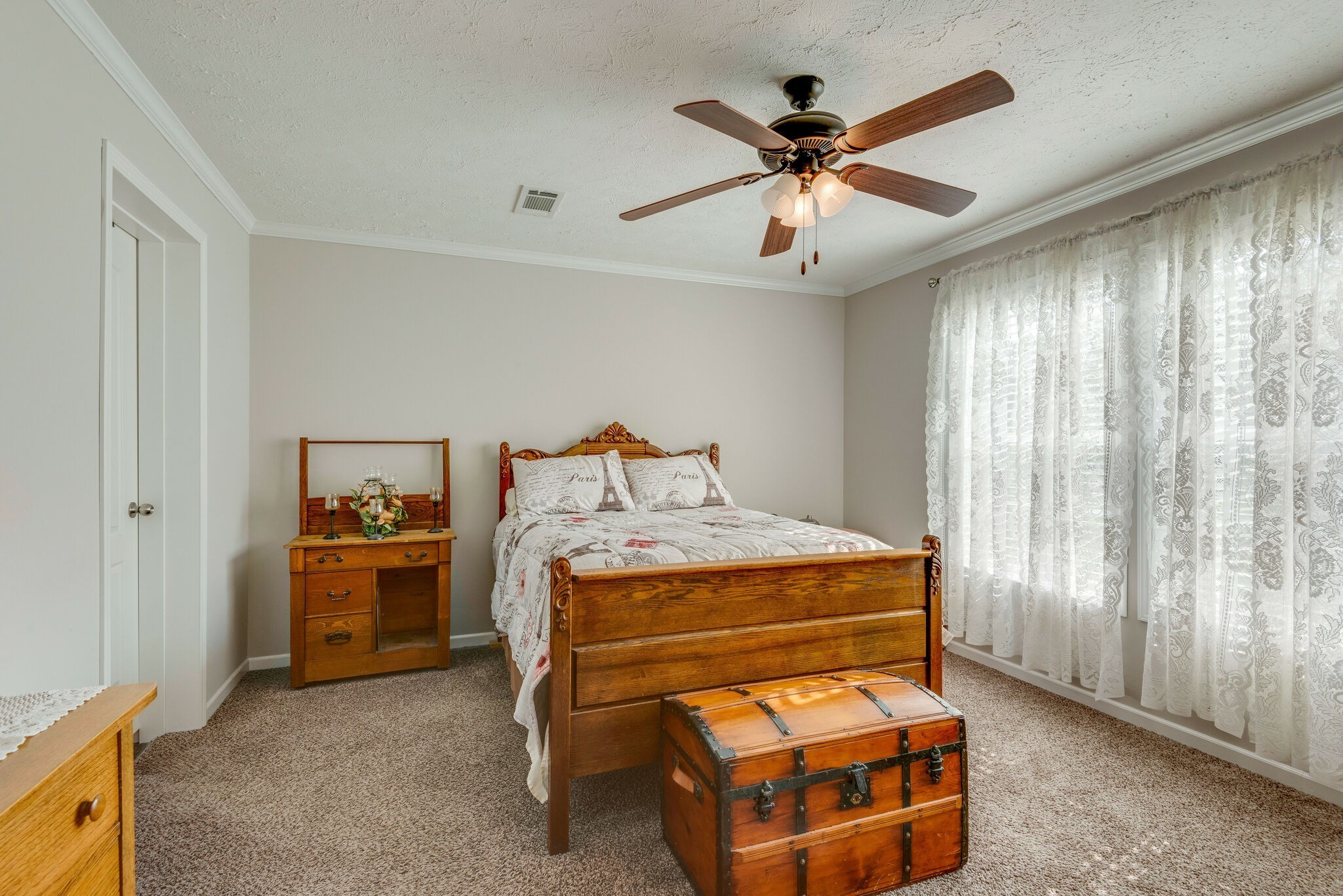 4585 West Tennessee City Road McEwen, TN 37101 - Photo 28 of 55 a bedroom with a bed and a chandelier