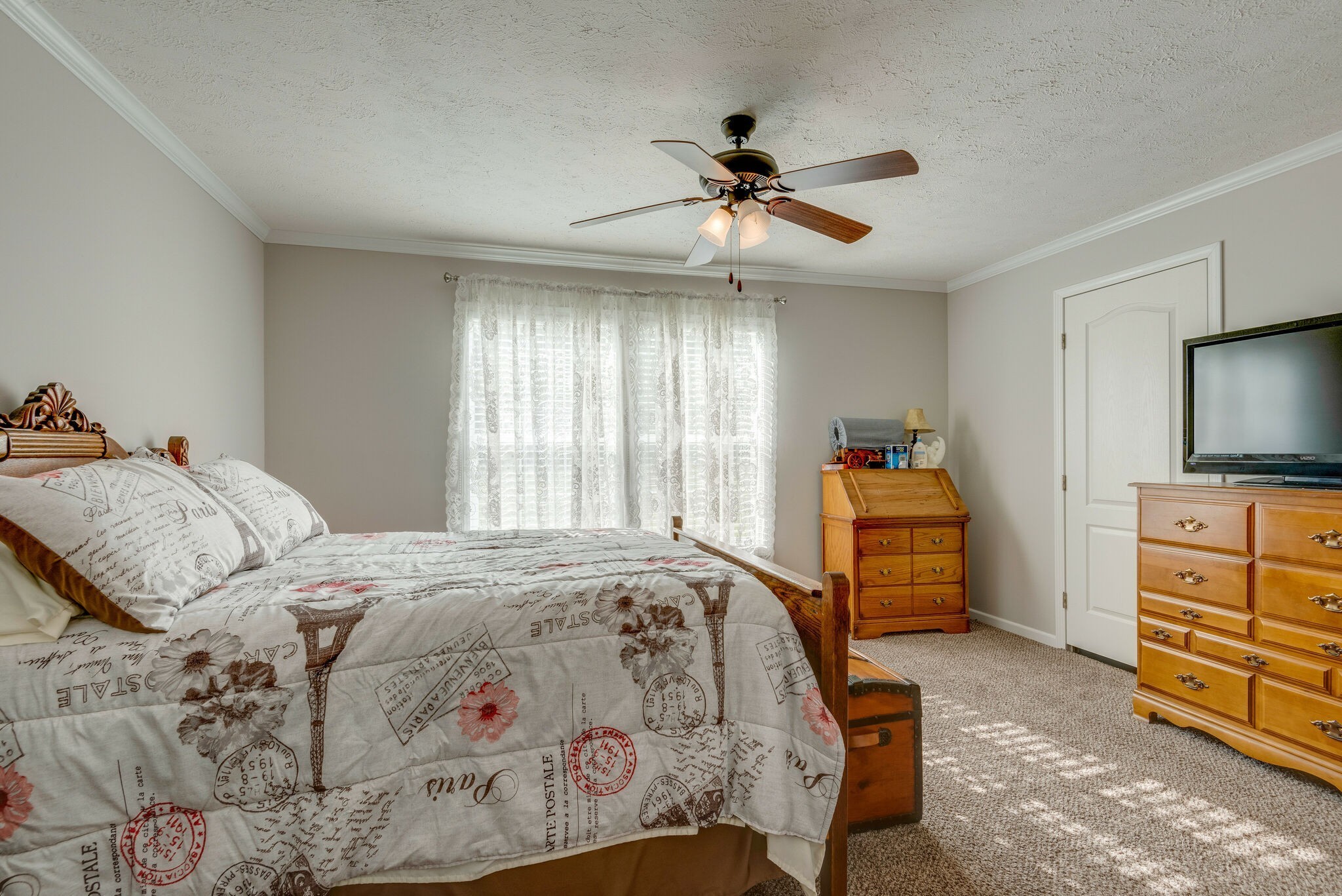 4585 West Tennessee City Road McEwen, TN 37101 - Photo 29 of 55 a bedroom with a bed and a flat screen tv