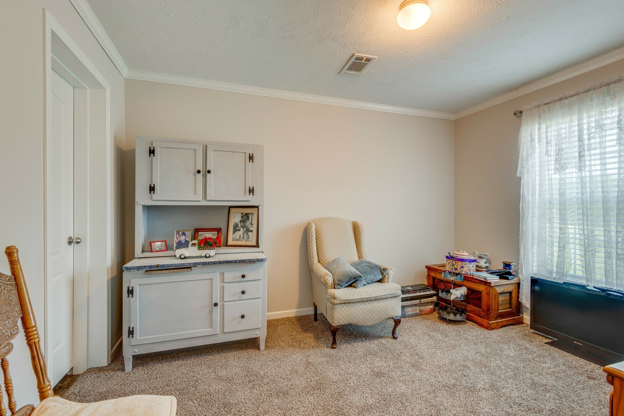 4585 West Tennessee City Road McEwen, TN 37101 - Photo 34 of 55 a living room with furniture and a window