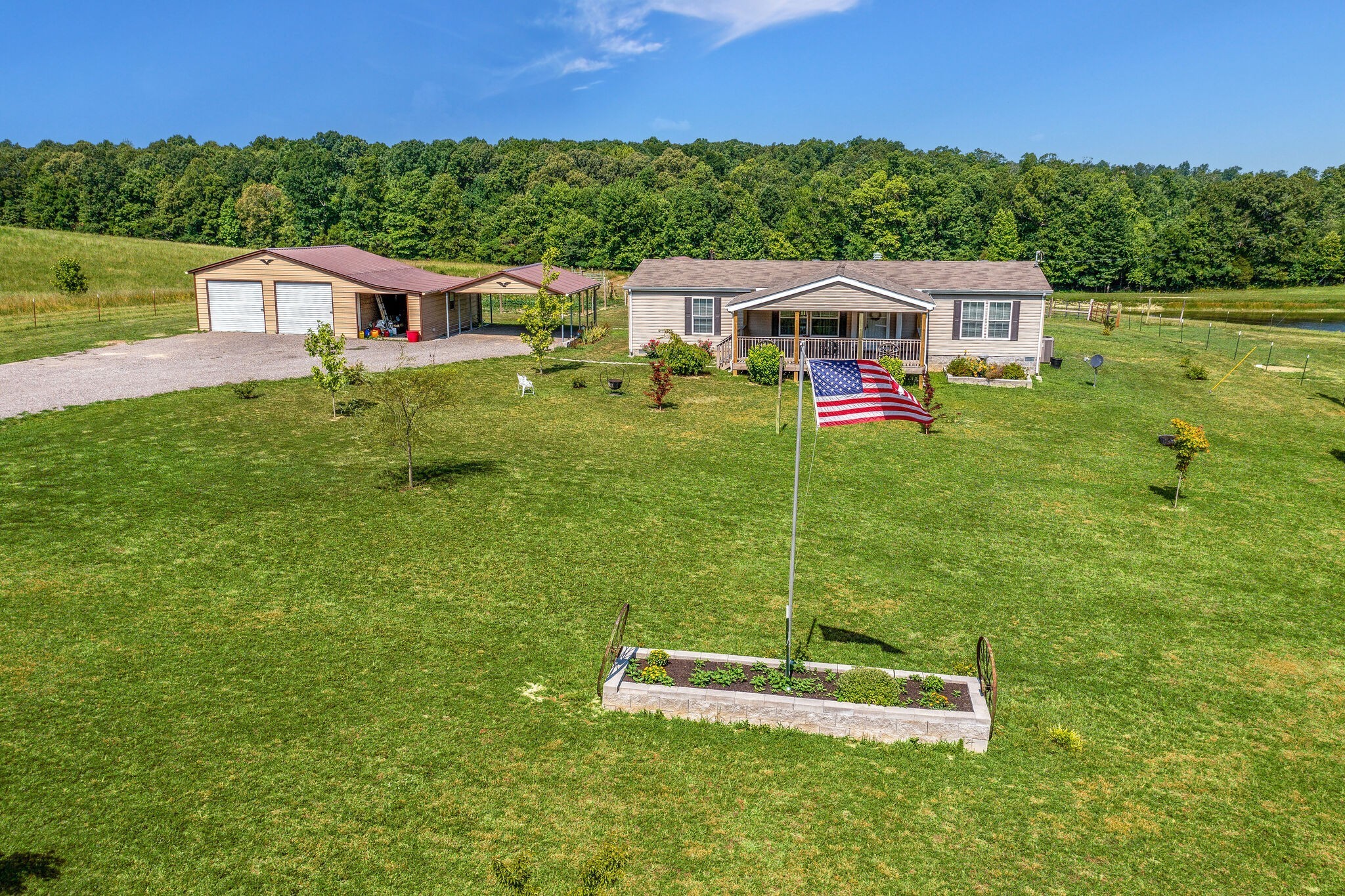 4585 West Tennessee City Road McEwen, TN 37101 - Photo 43 of 55 a aerial view of a house with backyard