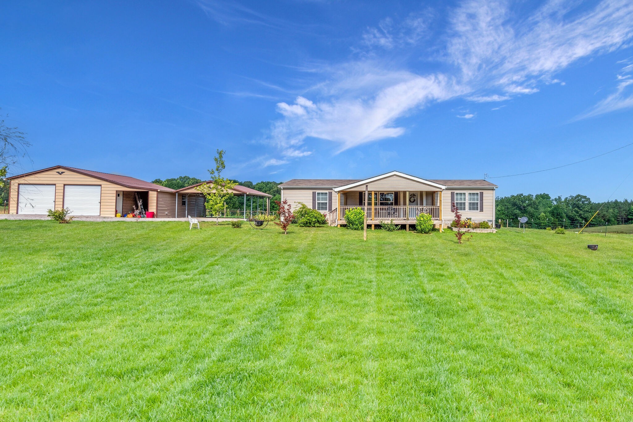 4585 West Tennessee City Road McEwen, TN 37101 - Photo 6 of 55 a house view with a garden space