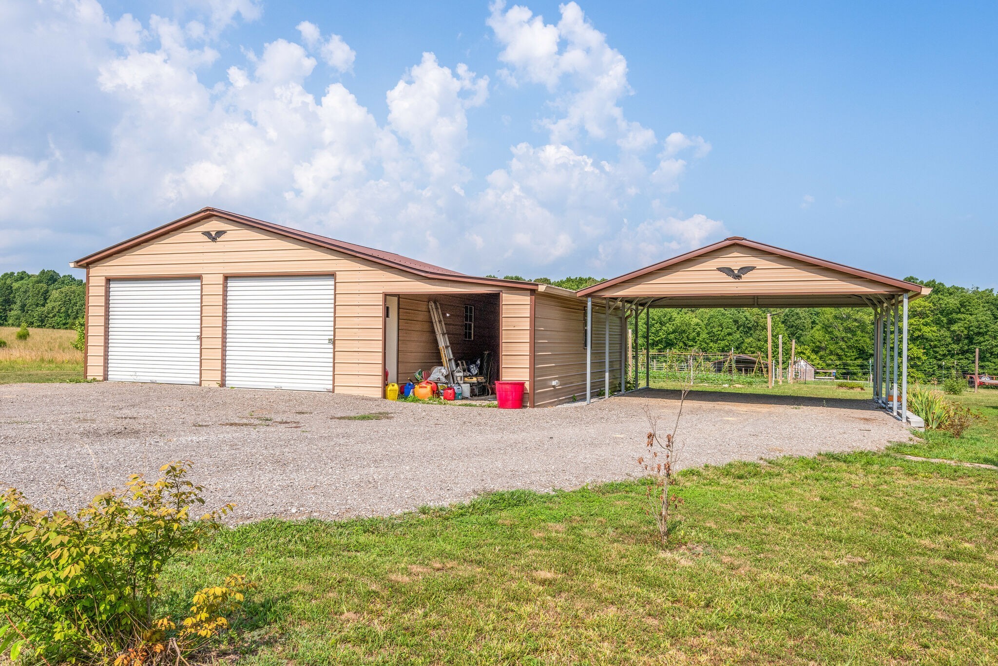 4585 West Tennessee City Road McEwen, TN 37101 - Photo 7 of 55 a front view of a house with a yard and garage