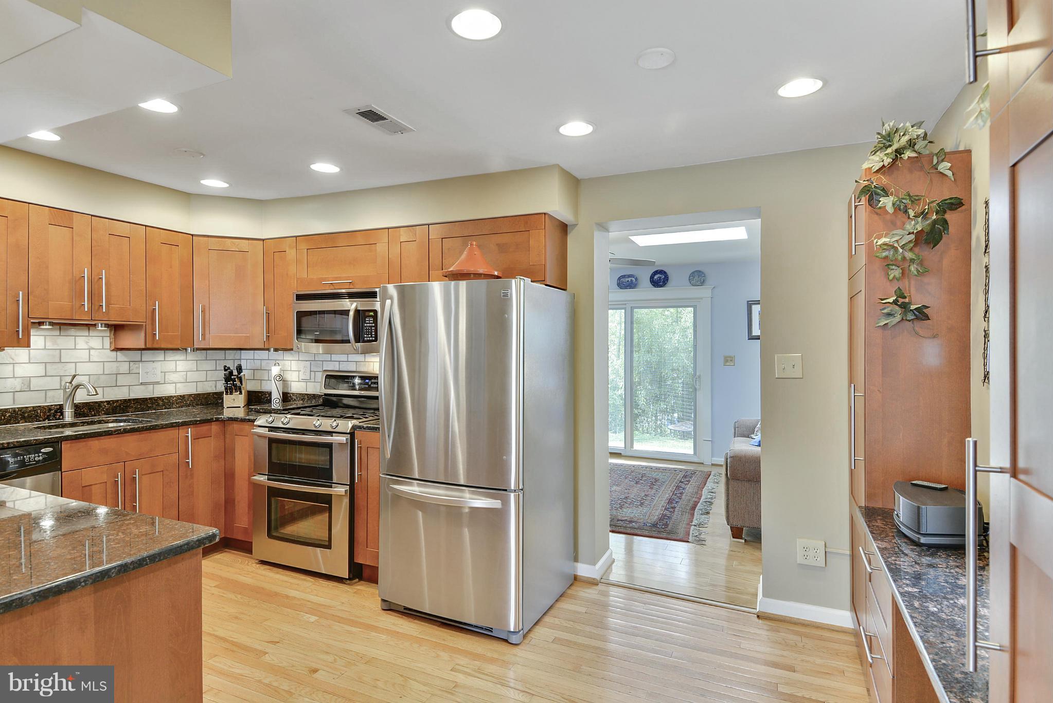 1021 Carson Street Silver Spring, MD 20901 - Photo 15 of 26 a kitchen with stainless steel appliances granite countertop a refrigerator and a stove top oven