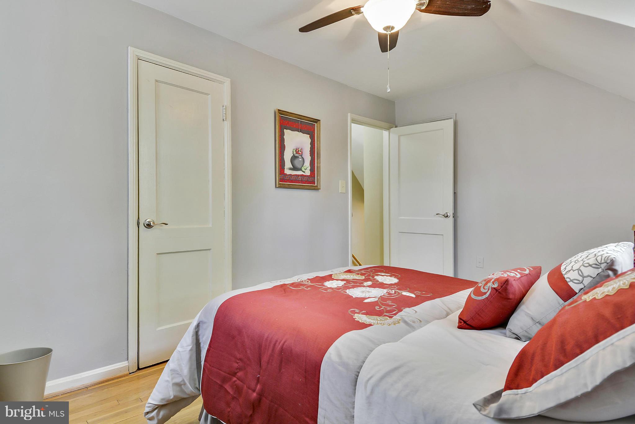 1021 Carson Street Silver Spring, MD 20901 - Photo 21 of 26 a bedroom with a bed and a chandelier