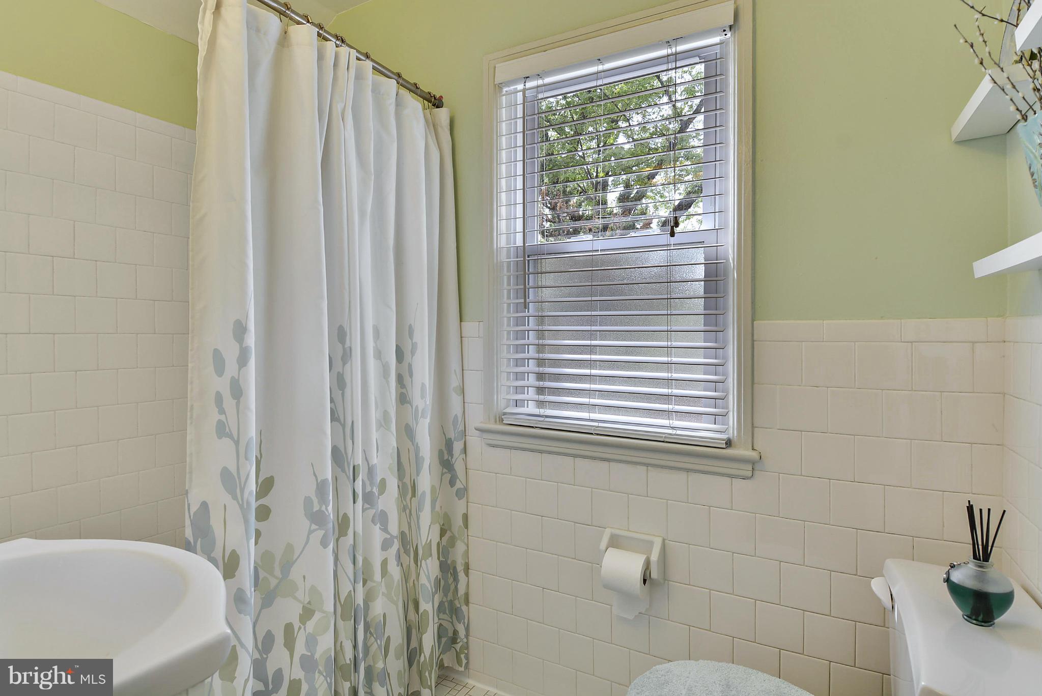 1021 Carson Street Silver Spring, MD 20901 - Photo 24 of 26 a bathroom with a bathtub and shower