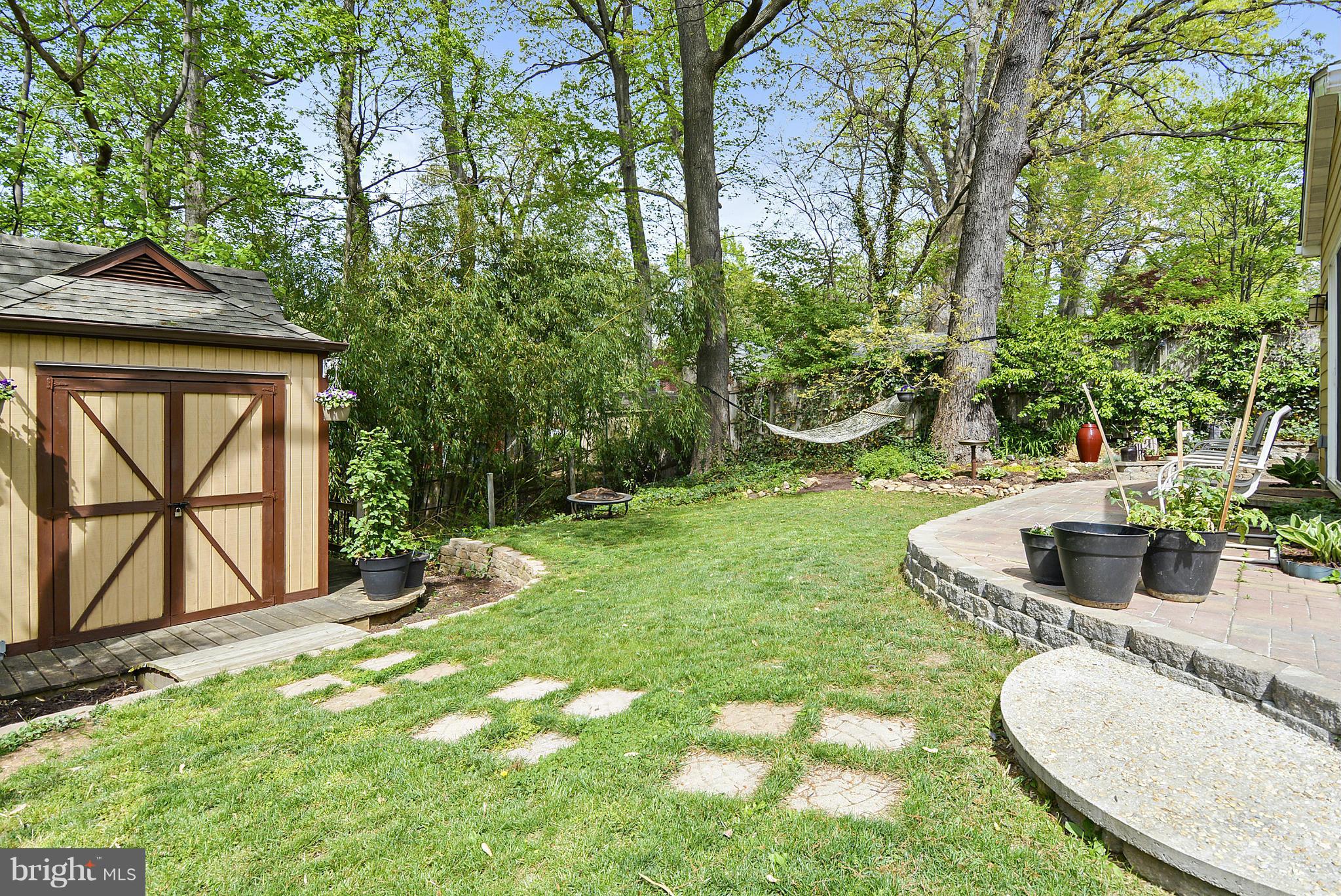 1021 Carson Street Silver Spring, MD 20901 - Photo 4 of 26 a backyard of a house with table and chairs