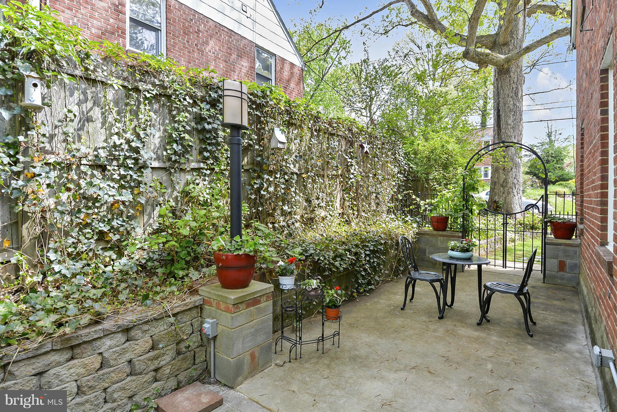 1021 Carson Street Silver Spring, MD 20901 - Photo 6 of 26 a balcony with table and chairs and potted plants