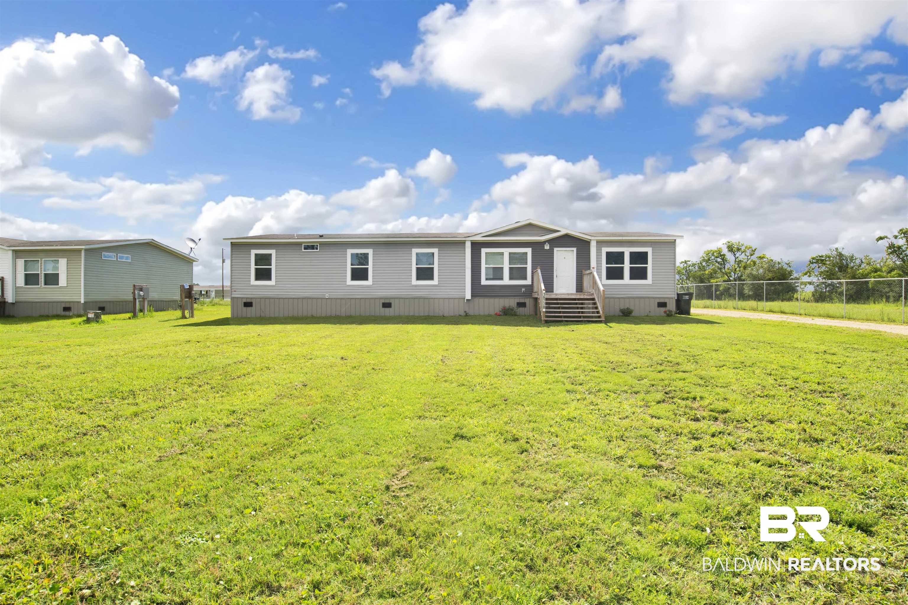 16778 County Road 87 Elberta, AL 36530 - Photo 2 of 32 Manufactured / mobile home featuring a front lawn