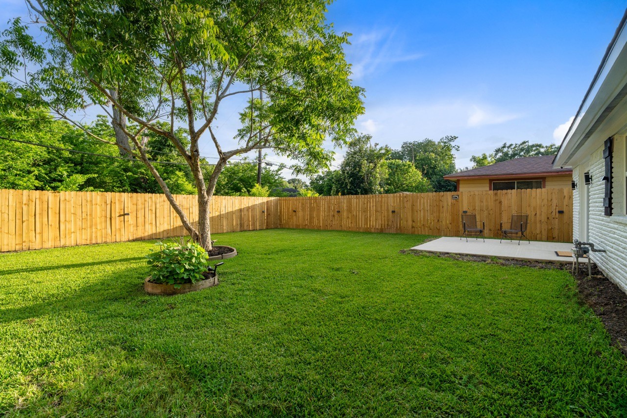 3138 Sunbeam Street Houston, TX 77051 - Photo 41 of 50 An expansive backyard oasis with lush green space, mature shade tree, and room to entertain, play, or unwind in total privacy.