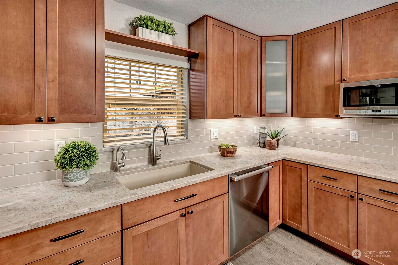 5300 Northeast 16th Street Renton, WA 98059 - Photo 13 of 38 a kitchen with stainless steel appliances granite countertop wooden cabinets a sink and dishwasher