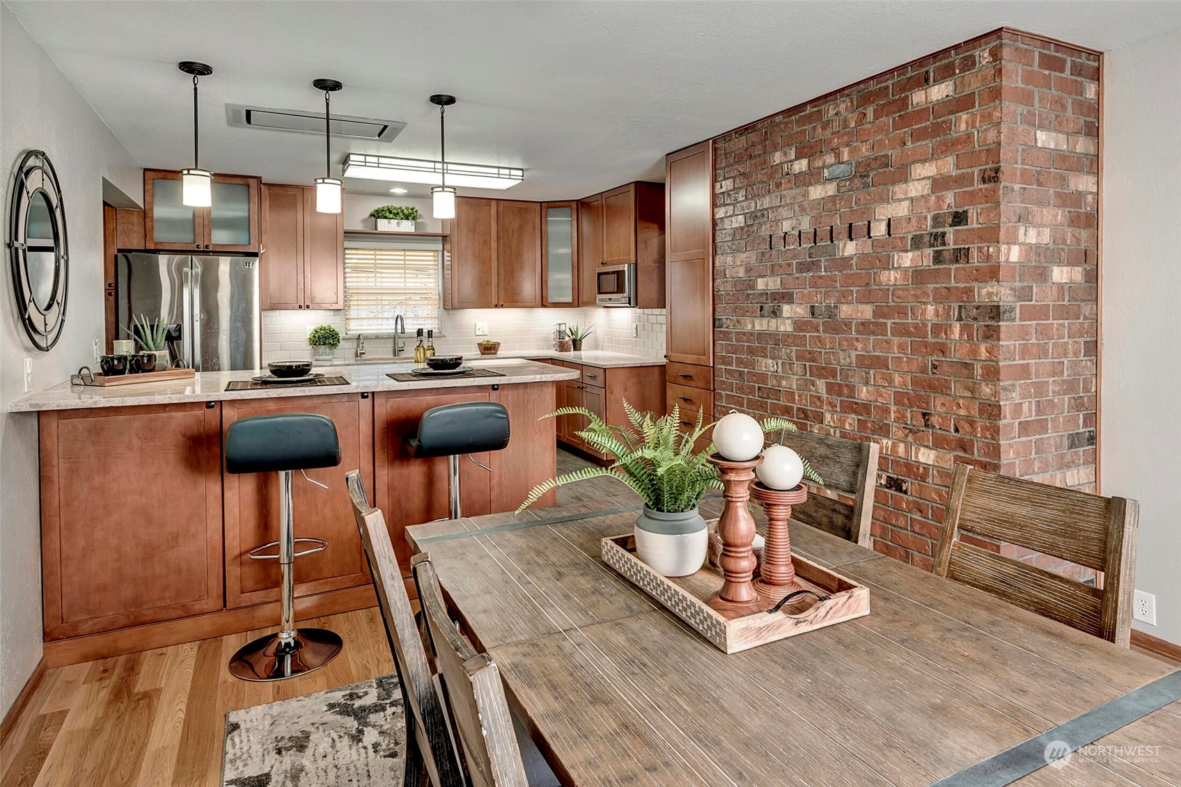 5300 Northeast 16th Street Renton, WA 98059 - Photo 16 of 38 a kitchen with a table chairs stove and cabinets
