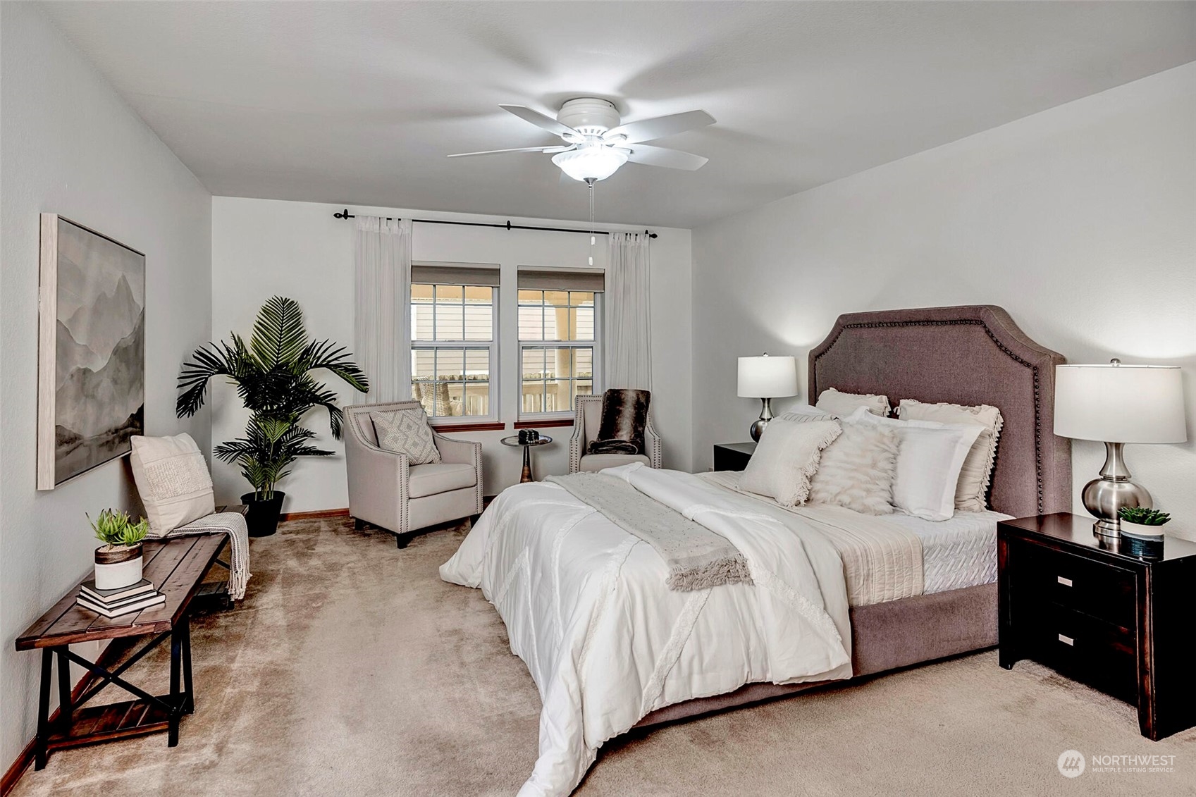 5300 Northeast 16th Street Renton, WA 98059 - Photo 19 of 38 a spacious bedroom with a bed and a chandelier