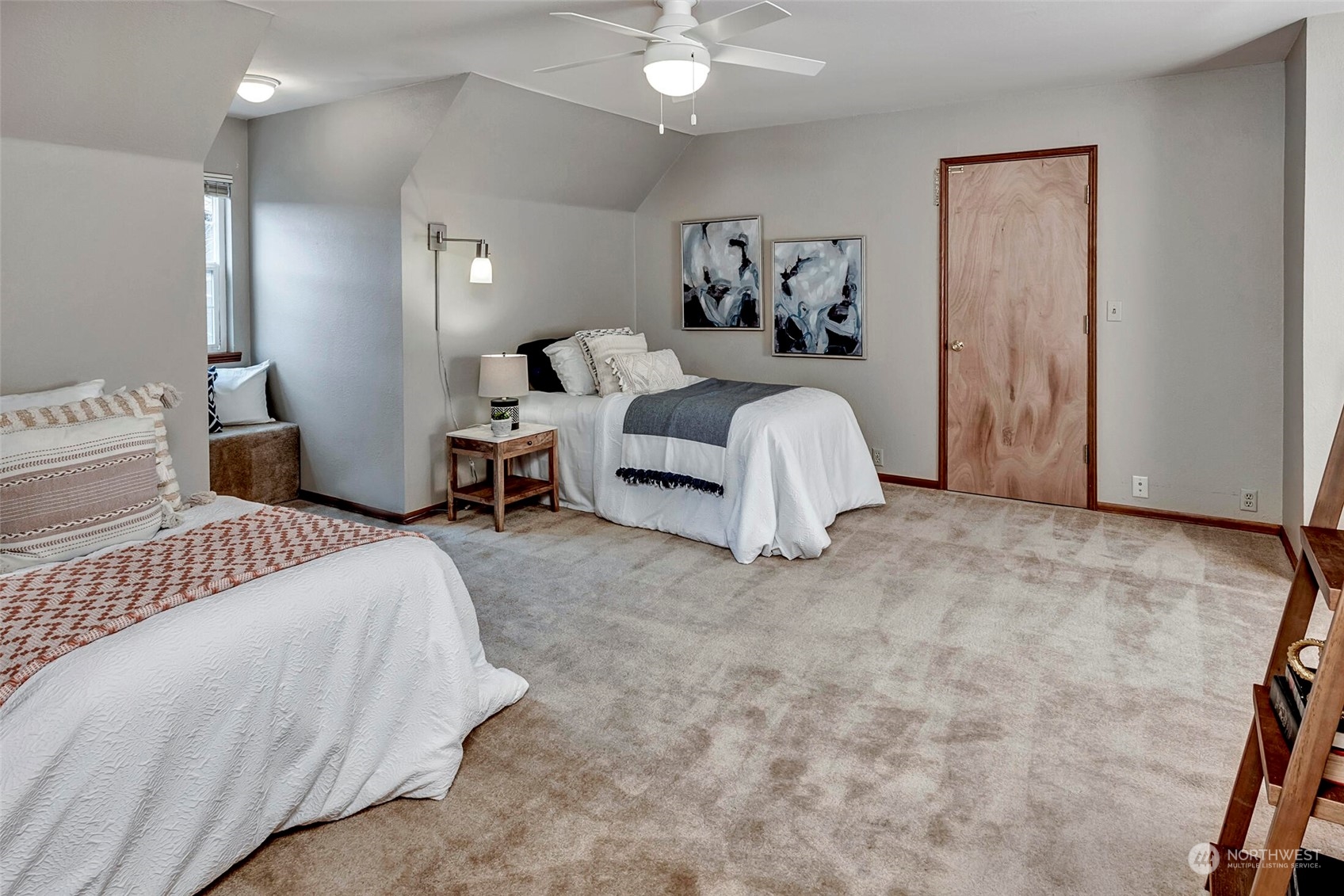 5300 Northeast 16th Street Renton, WA 98059 - Photo 26 of 38 a bedroom with a bed and a couch