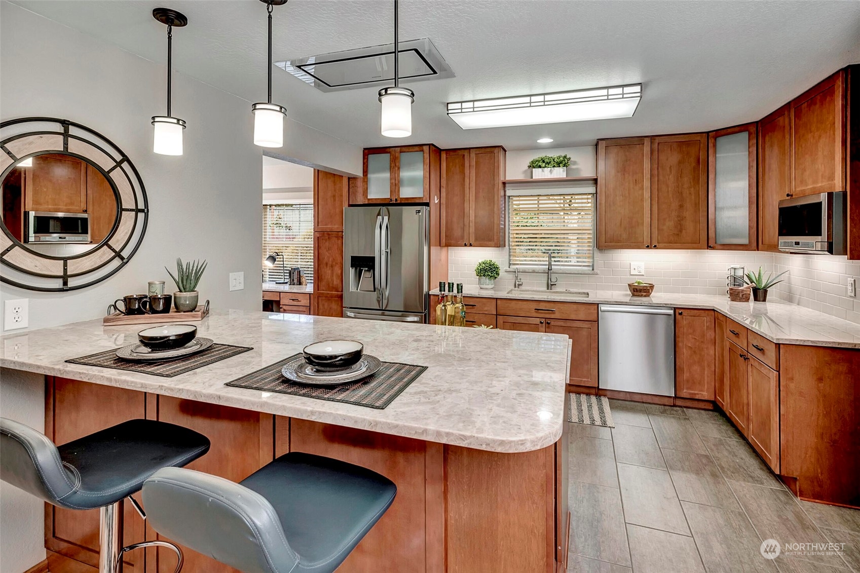 5300 Northeast 16th Street Renton, WA 98059 - Photo 10 of 38 a kitchen with a sink a stove and chairs