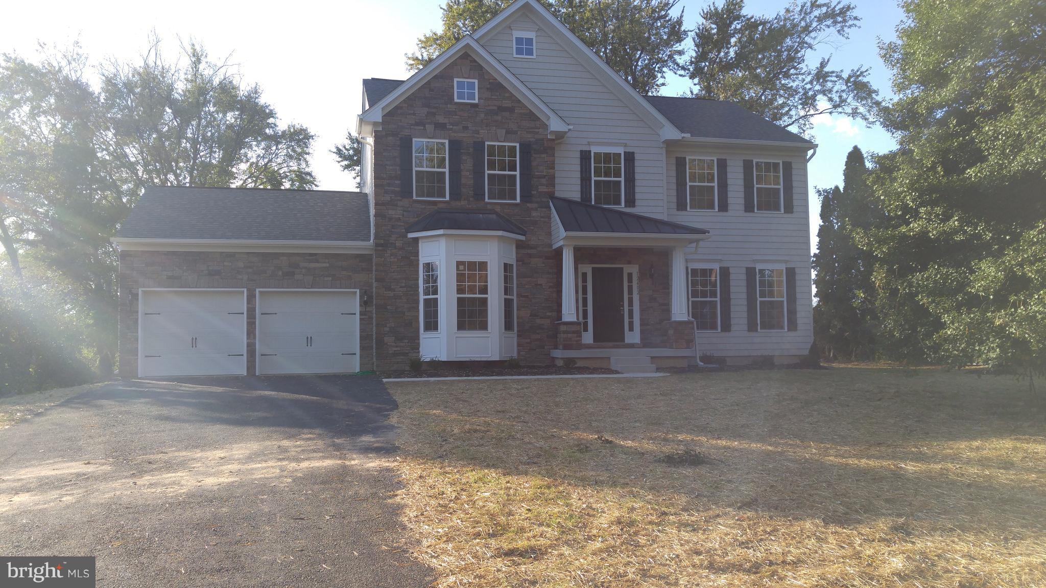 1339 Ryan Road Fallston, MD 21047 - Photo 1 of 5 a front view of a house with a yard and garage