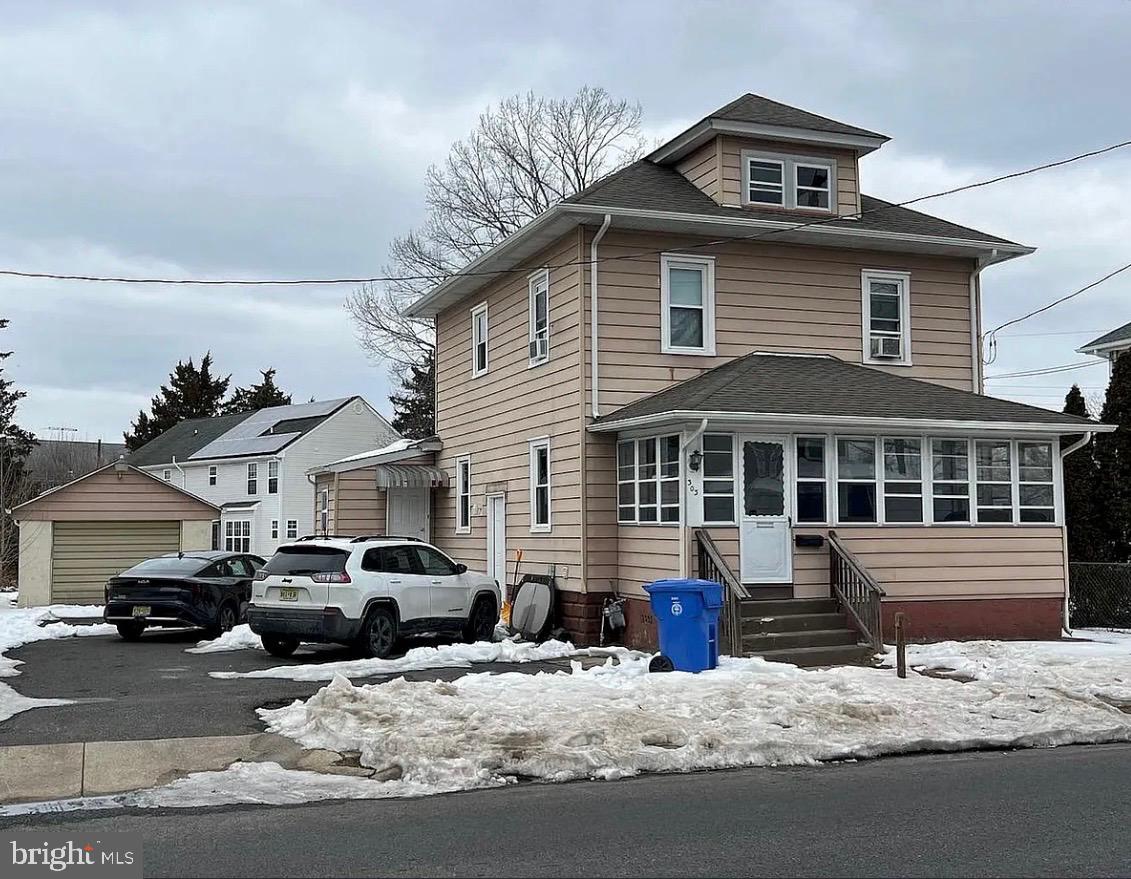 303 Ellis Street Glassboro, NJ 08028 - Photo 2 of 10 a front view of a house with cars parked
