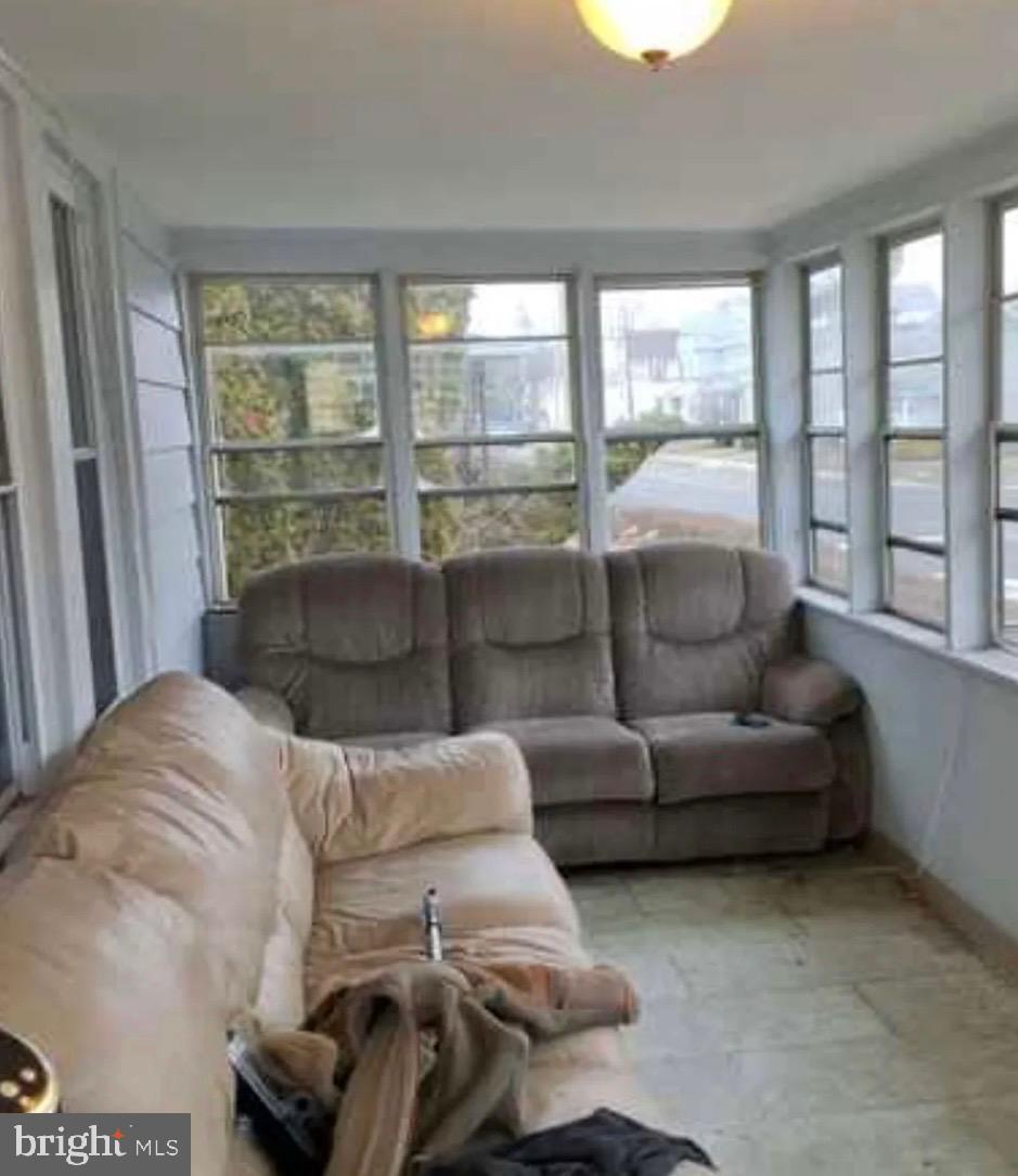 303 Ellis Street Glassboro, NJ 08028 - Photo 7 of 10 a living room with furniture and a large window