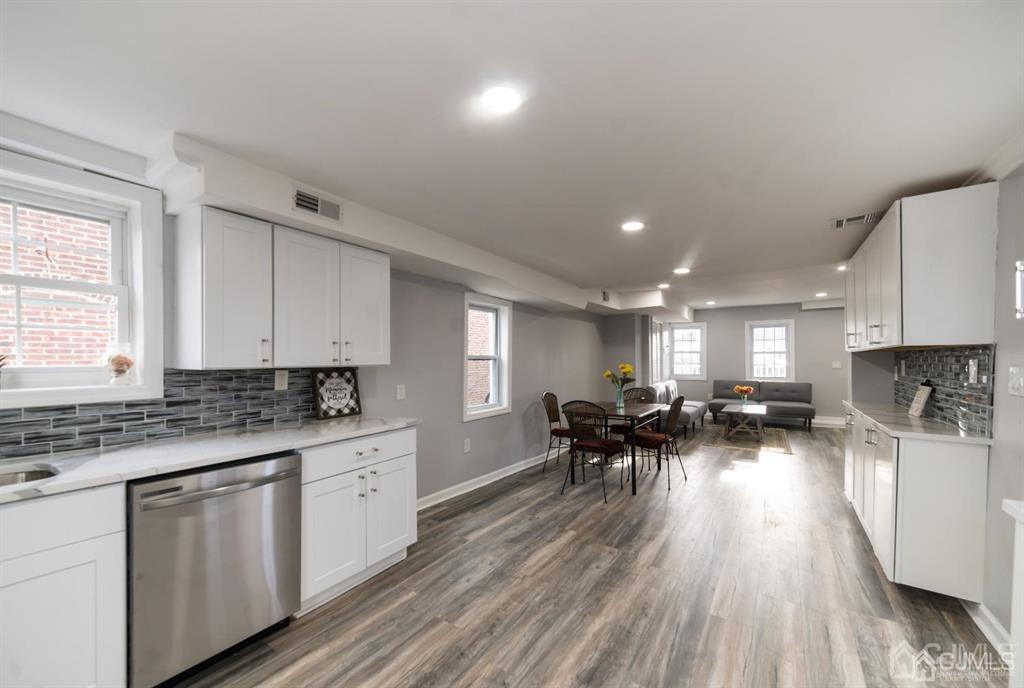 8 Main Street Matawan, NJ 07747 - Photo 15 of 36 a kitchen with a sink a counter top space and stainless steel appliances