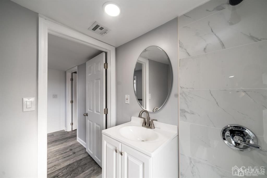 8 Main Street Matawan, NJ 07747 - Photo 20 of 36 a bathroom with a sink and a mirror