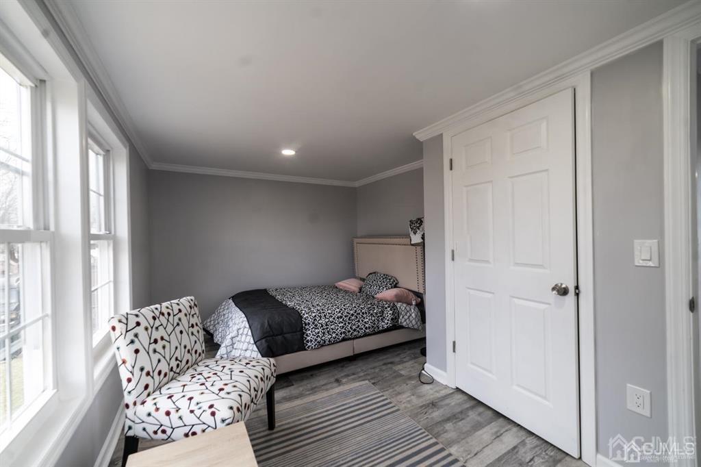 8 Main Street Matawan, NJ 07747 - Photo 22 of 36 a bedroom with a bed and a window