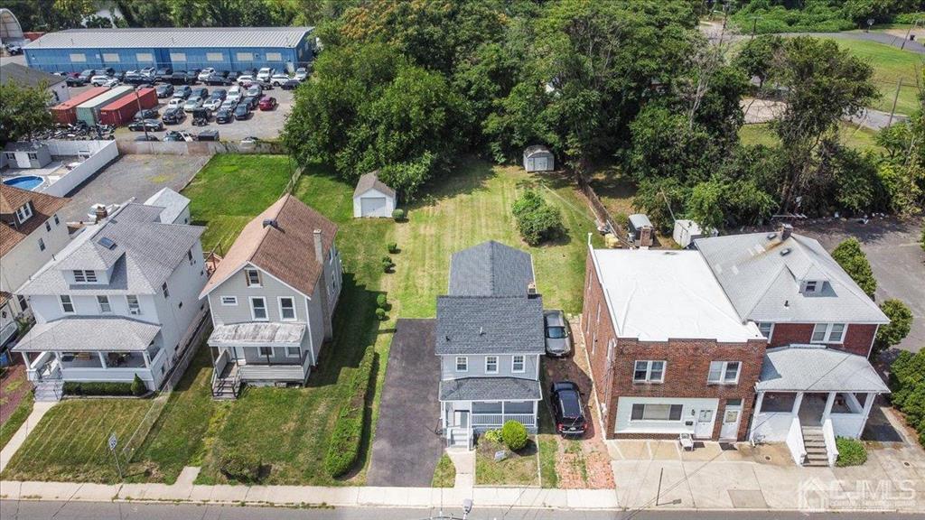 8 Main Street Matawan, NJ 07747 - Photo 28 of 36 an aerial view of residential houses with outdoor space and parking