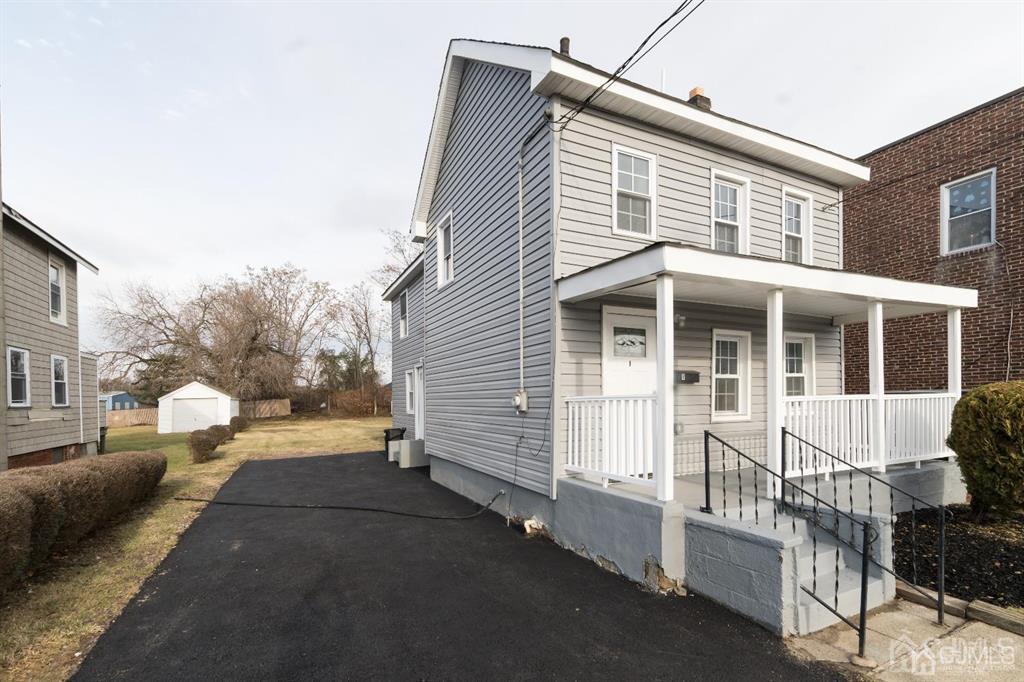 8 Main Street Matawan, NJ 07747 - Photo 4 of 36 a front view of a house with a yard