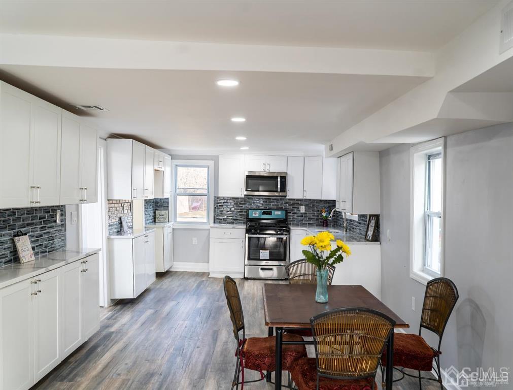 8 Main Street Matawan, NJ 07747 - Photo 10 of 36 a view of kitchen with cabinets and wooden floor