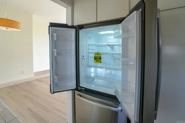 a bathroom with a shower and a mirror