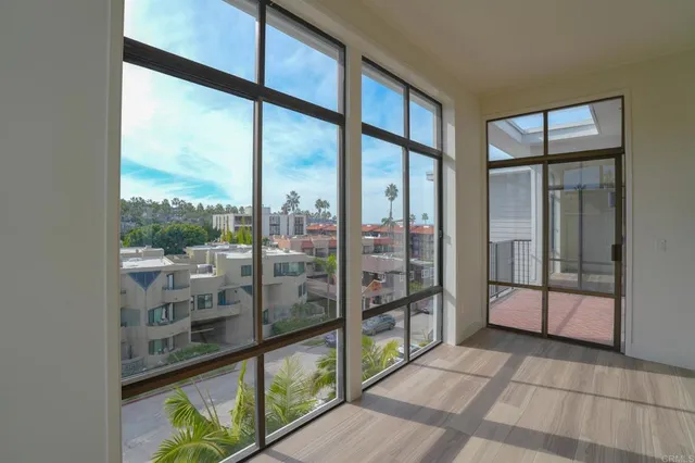 a view of a glass door with a balcony