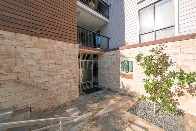 a view of house with backyard and shower