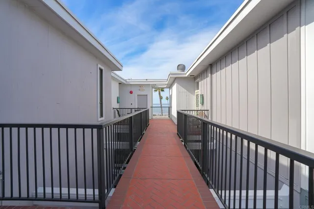 a view of a balcony with wooden floor