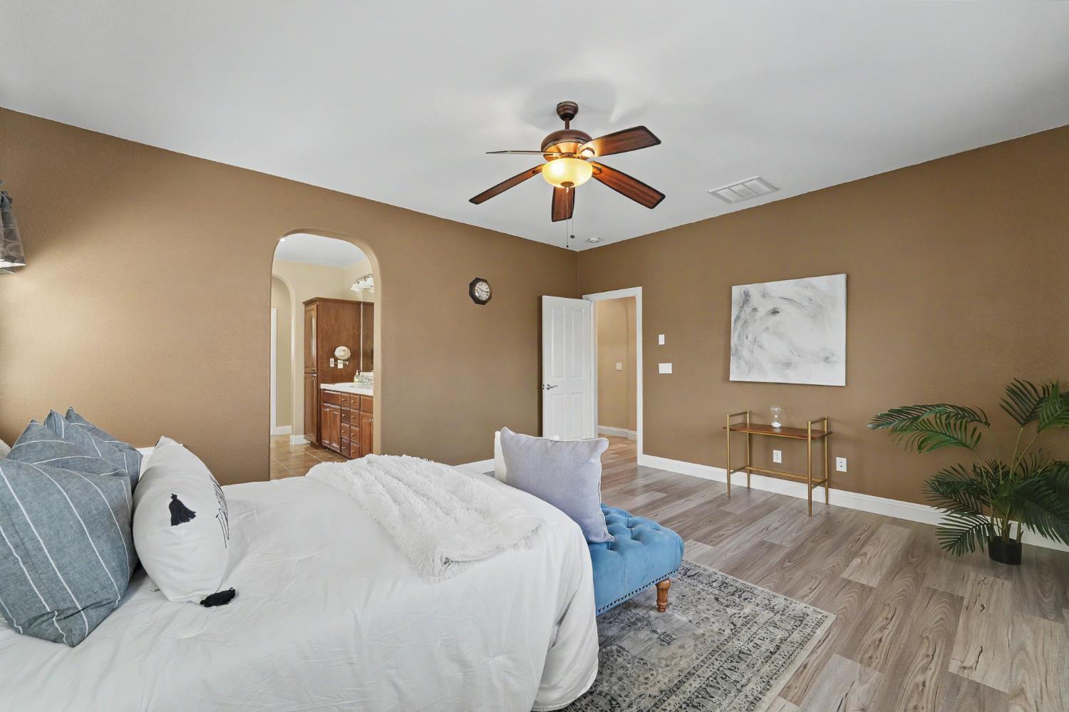1223 East Springer Drive Turlock, CA 95382 - Photo 26 of 48 a bedroom with a bed and wooden floor
