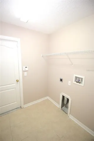 a bathroom with a granite countertop sink toilet and mirror