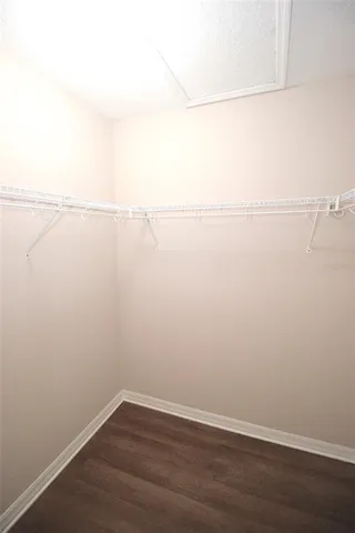 a bathroom with a bathtub shower sink and mirror