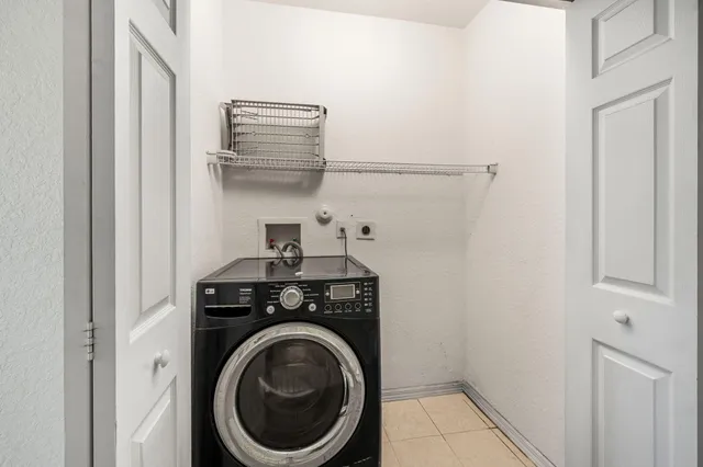 a white toilet sitting next to a shower