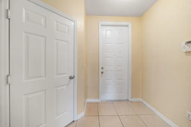 a kitchen with a sink stove and refrigerator