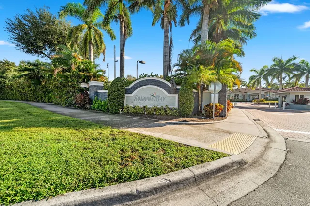 a house with palm tree in front of it