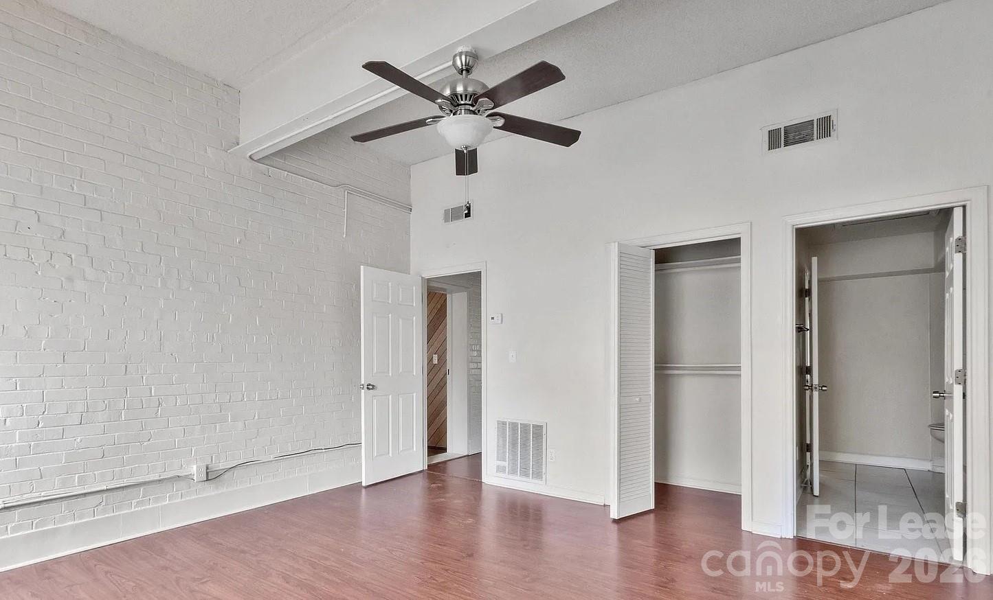 203 West Liberty Street, Unit PH York, SC 29745 - Photo 2 of 10 wooden floor in an empty room
