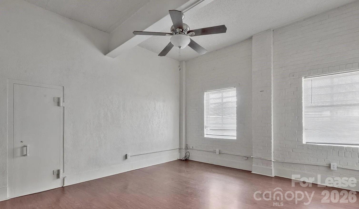 203 West Liberty Street, Unit PH York, SC 29745 - Photo 3 of 10 a view of an empty room with a window