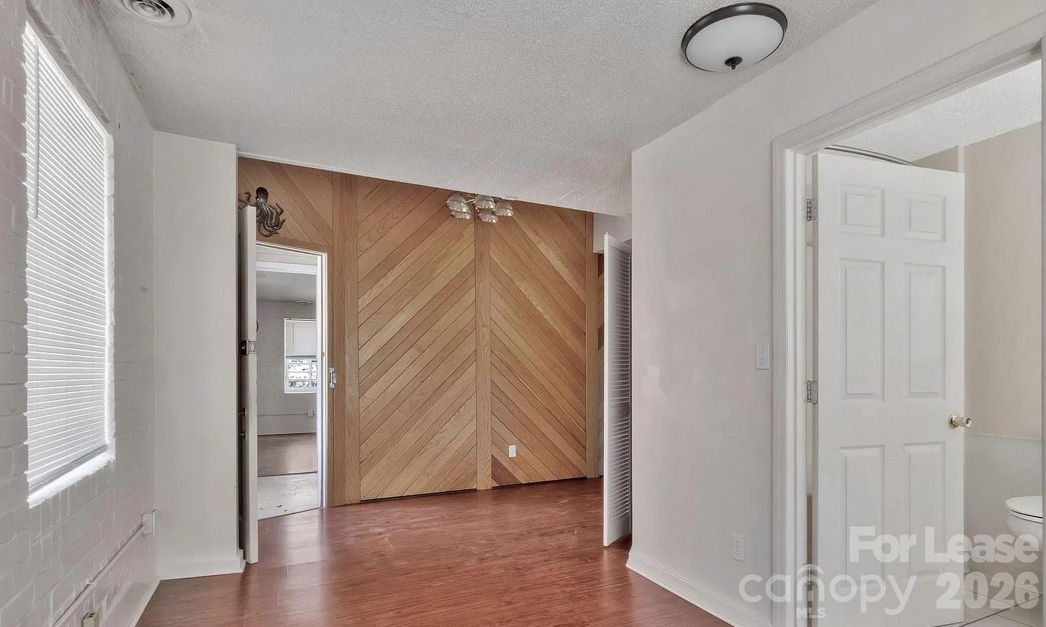 203 West Liberty Street, Unit PH York, SC 29745 - Photo 5 of 10 a view of an entryway with wooden floor
