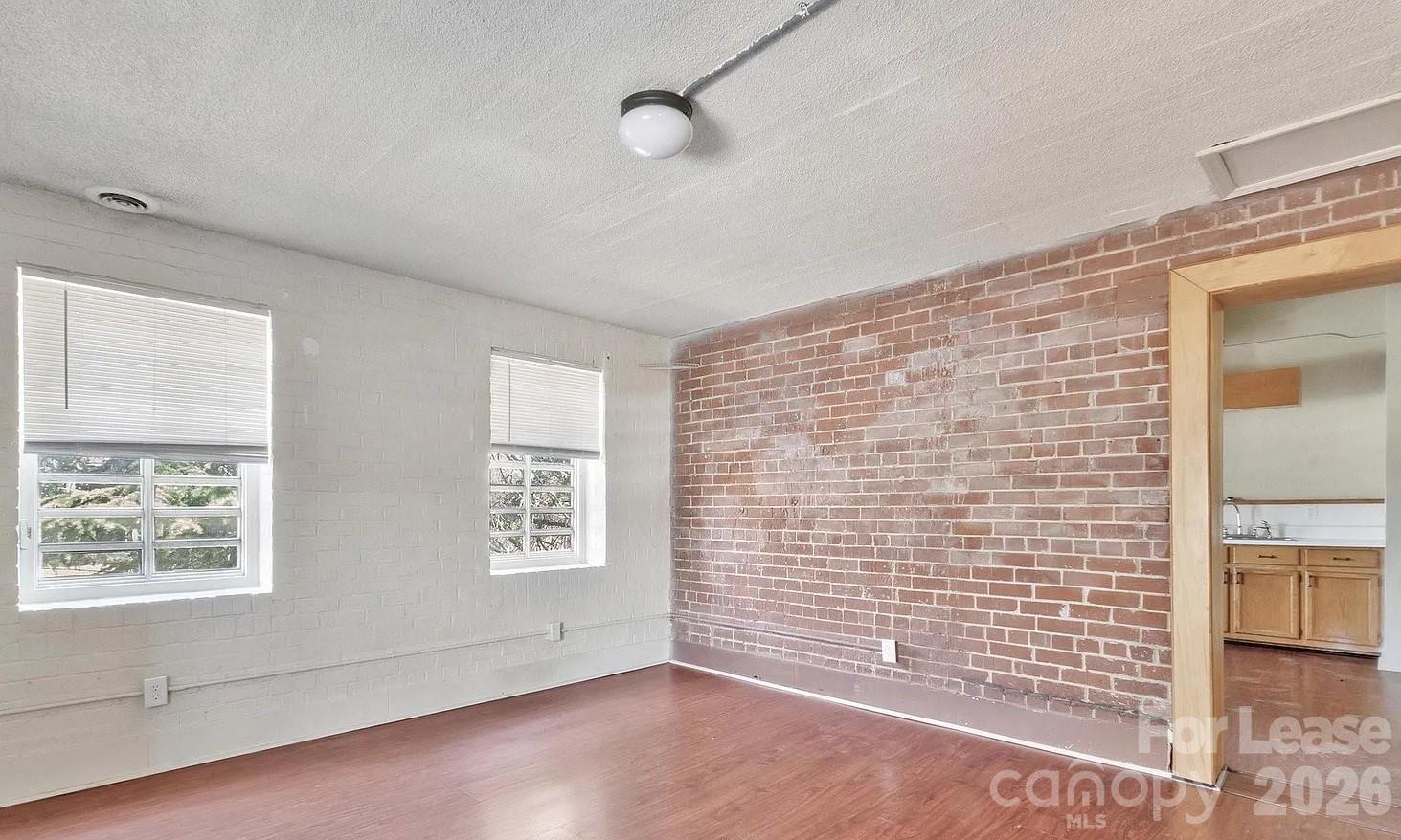203 West Liberty Street, Unit PH York, SC 29745 - Photo 10 of 10 a view of an empty room with a window