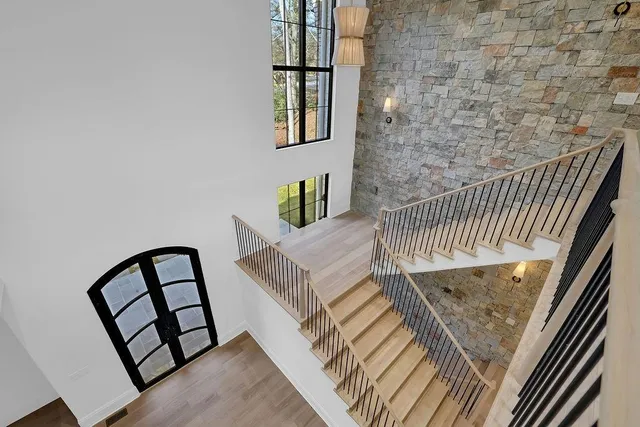 a large kitchen with kitchen island granite countertop a sink and a stove