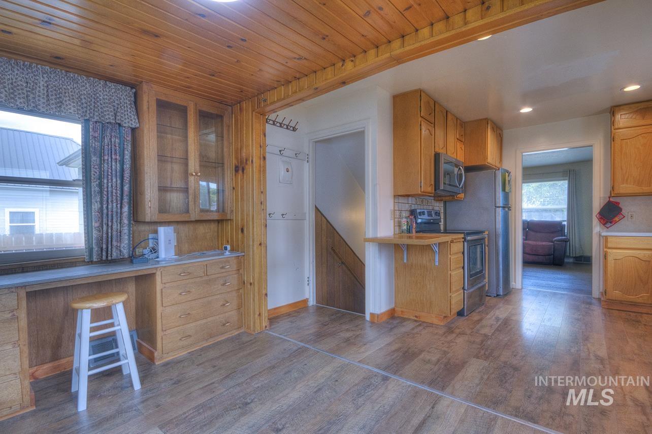 351 West Main Street South Vale, OR 97918 - Photo 7 of 33 Kitchen area featuring wood-finish flooring, wood plank ceiling, and natural wood cabinetry