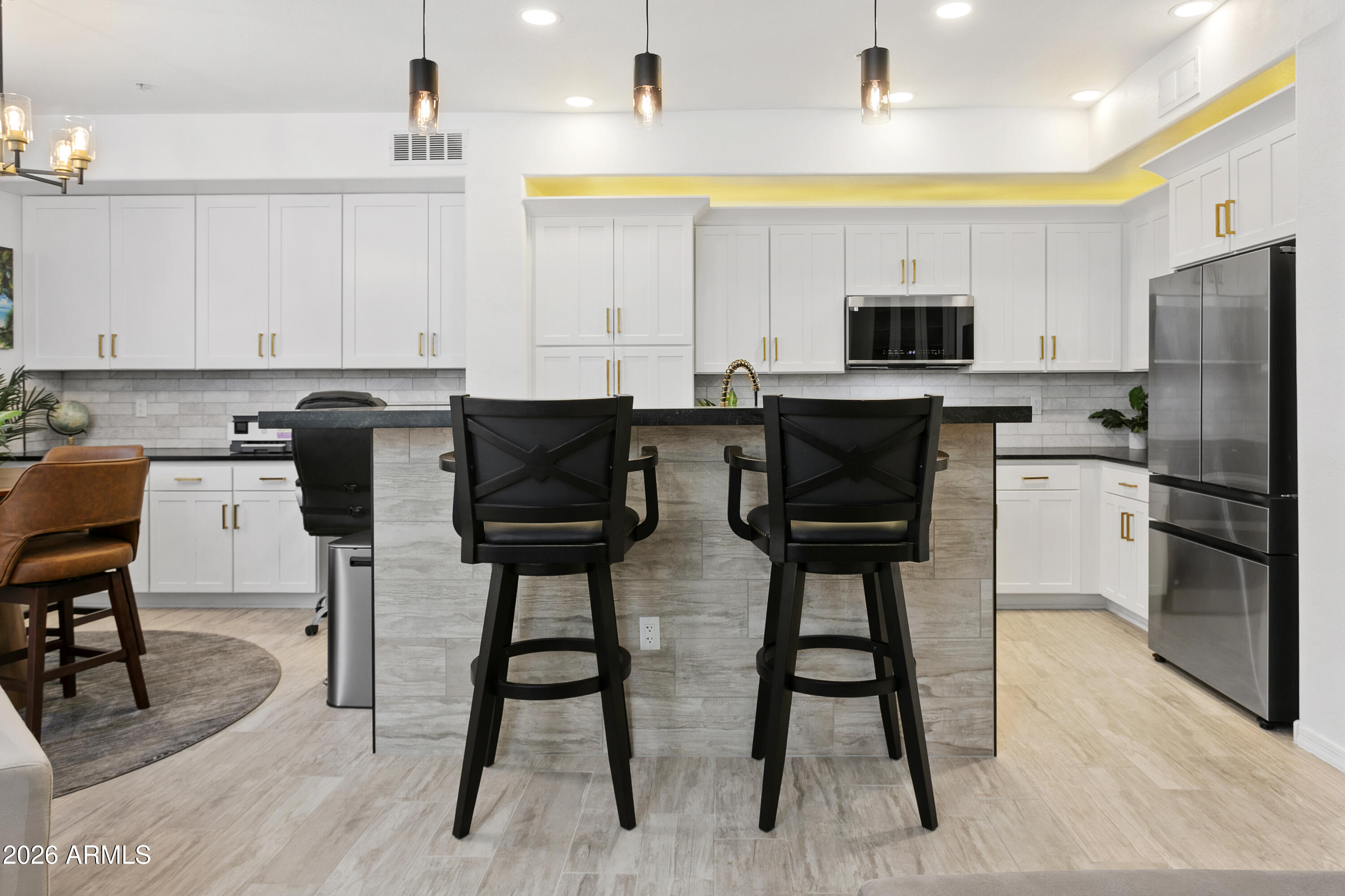 7601 East Indian Bend Road, Unit 1017 Scottsdale, AZ 85250 - Photo 1 of 49 a kitchen with stainless steel appliances a stove a sink and a refrigerator