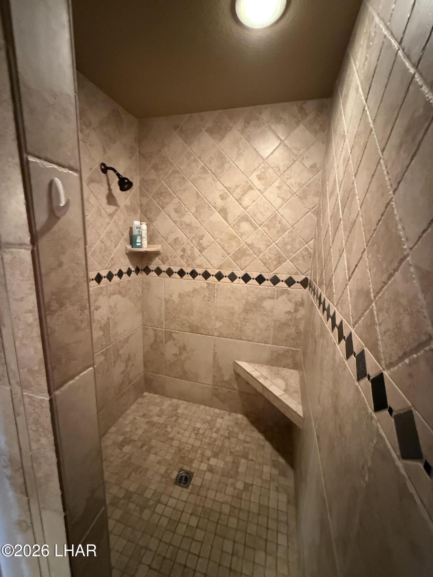 433 London Bridge Road, Unit B101 Lake Havasu City, AZ 86403 - Photo 27 of 35 a bathroom with a shower