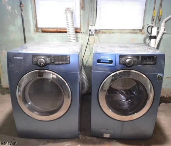 a utility room with sink dryer and washer