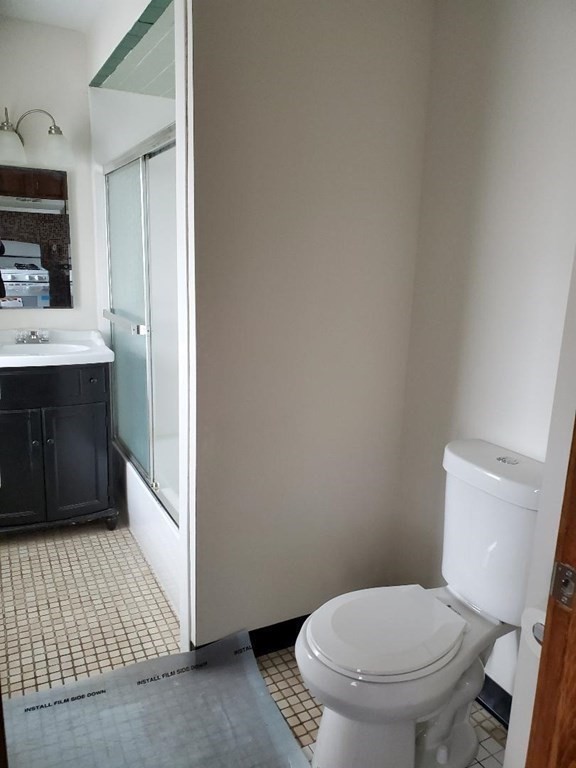 0 Coggeshall Street, Unit 1 Fall River, MA 02721 - Photo 9 of 11 a bathroom with a sink and a toilet