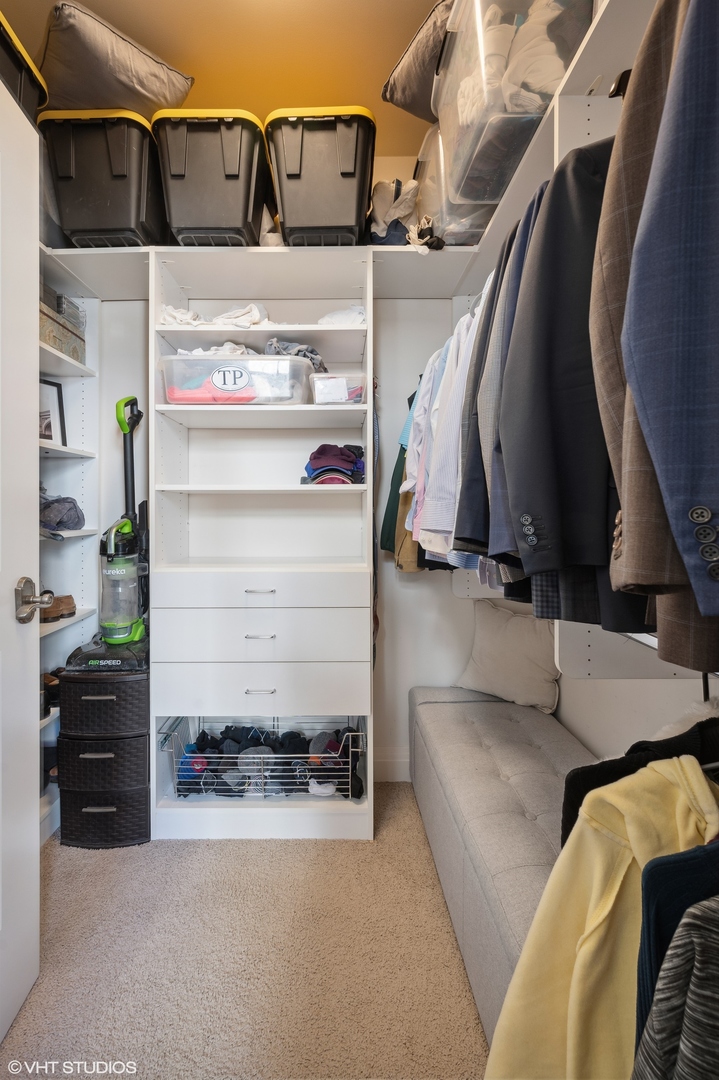 1041 Ridge Road, Unit 217 Wilmette, IL 60091 - Photo 12 of 19 a view of walk in closet with clothes and shoes