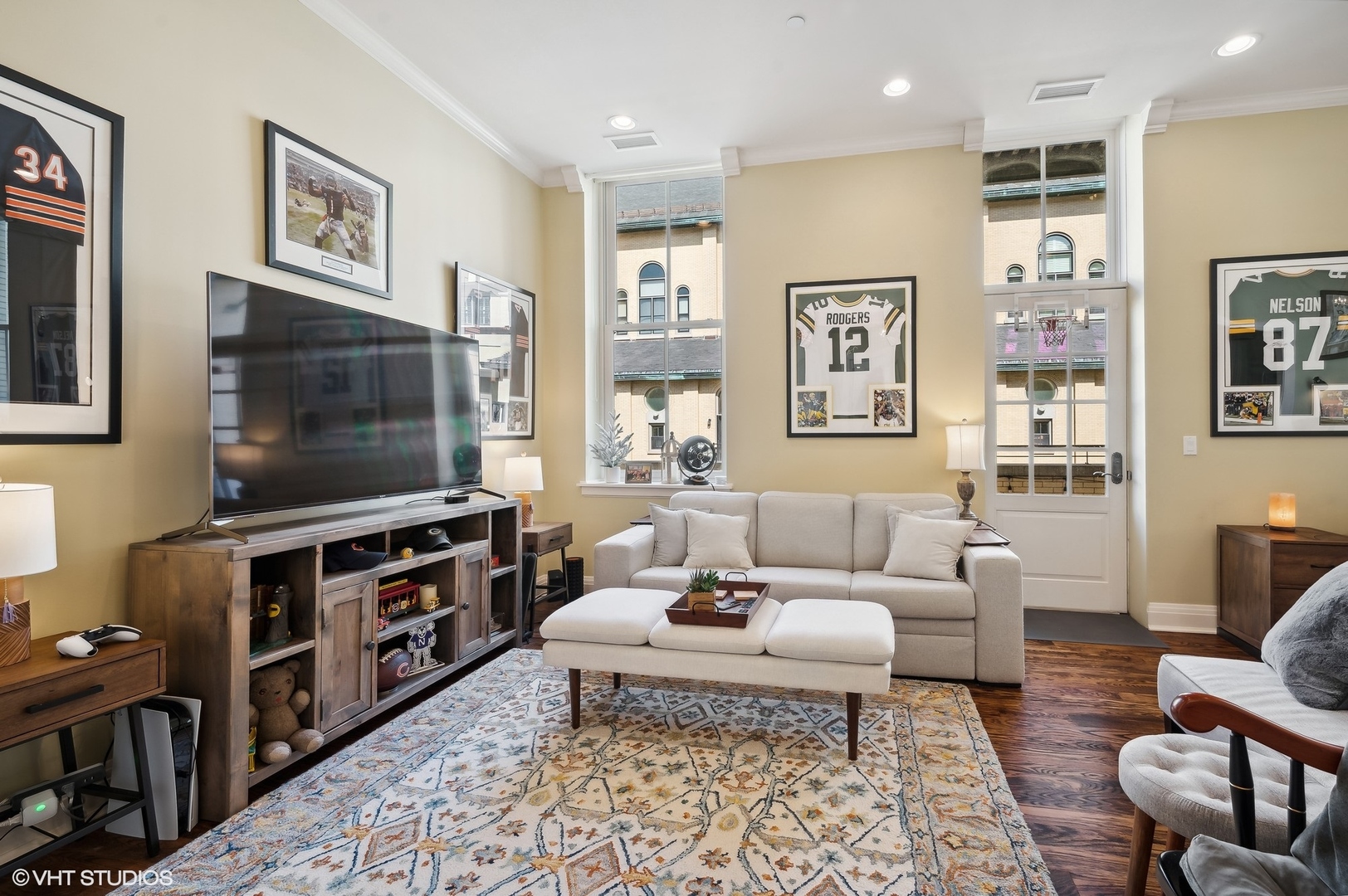 1041 Ridge Road, Unit 217 Wilmette, IL 60091 - Photo 2 of 19 a living room with furniture and a flat screen tv