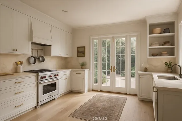 a kitchen with stainless steel appliances granite countertop a stove and a sink